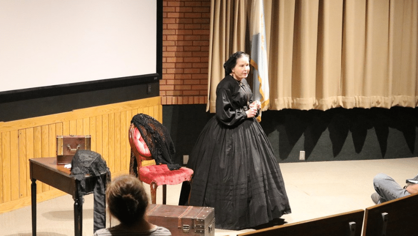 Pam Brown portraying Mary Todd Lincoln on stage.